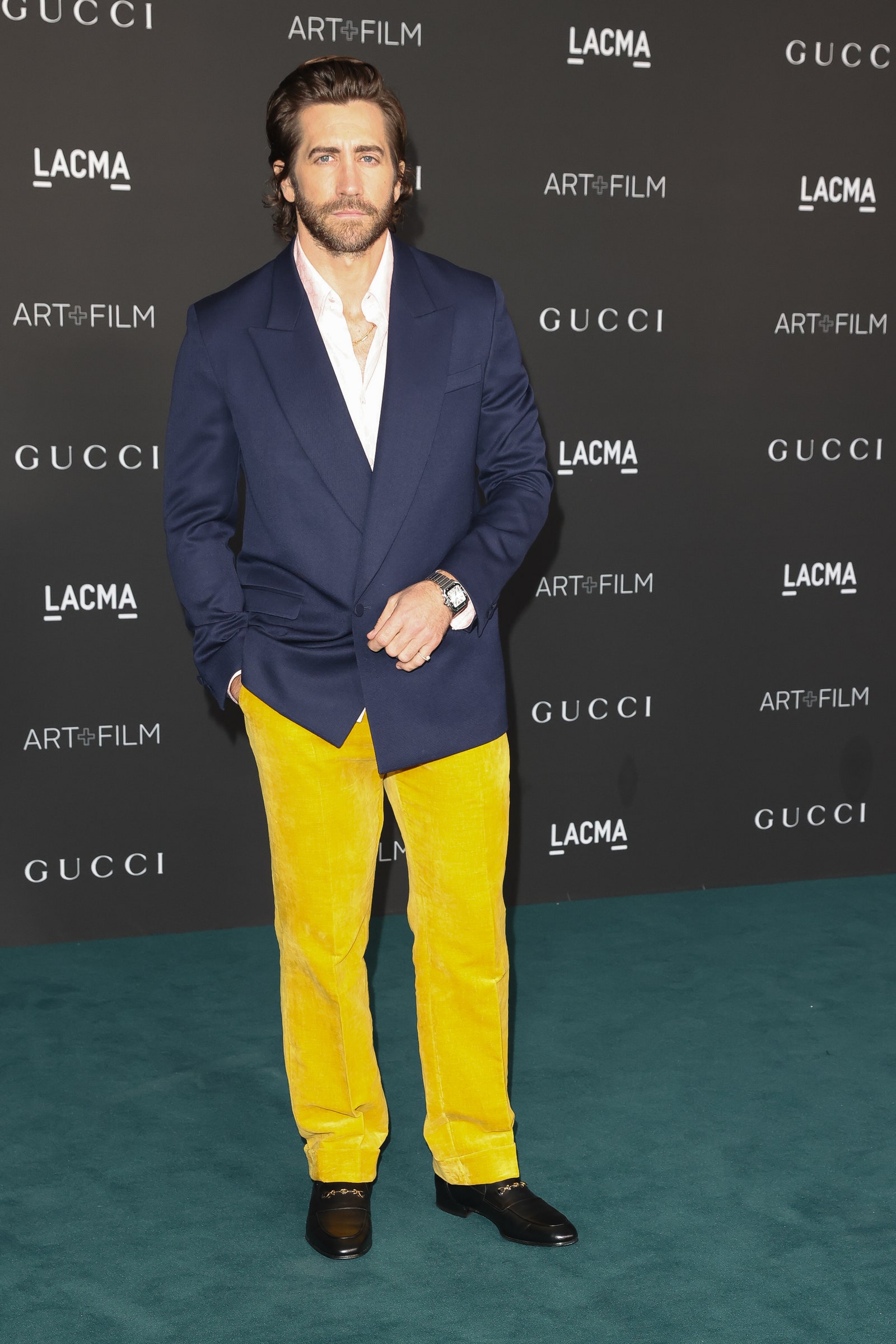 Image may contain Jake Gyllenhaal Suit Coat Clothing Overcoat Apparel Human and Person