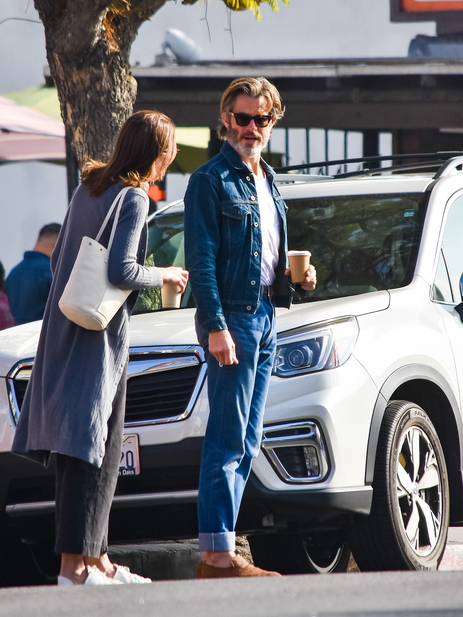 Image may contain Human Person Clothing Apparel Pants Sunglasses Accessories Accessory Transportation and Vehicle