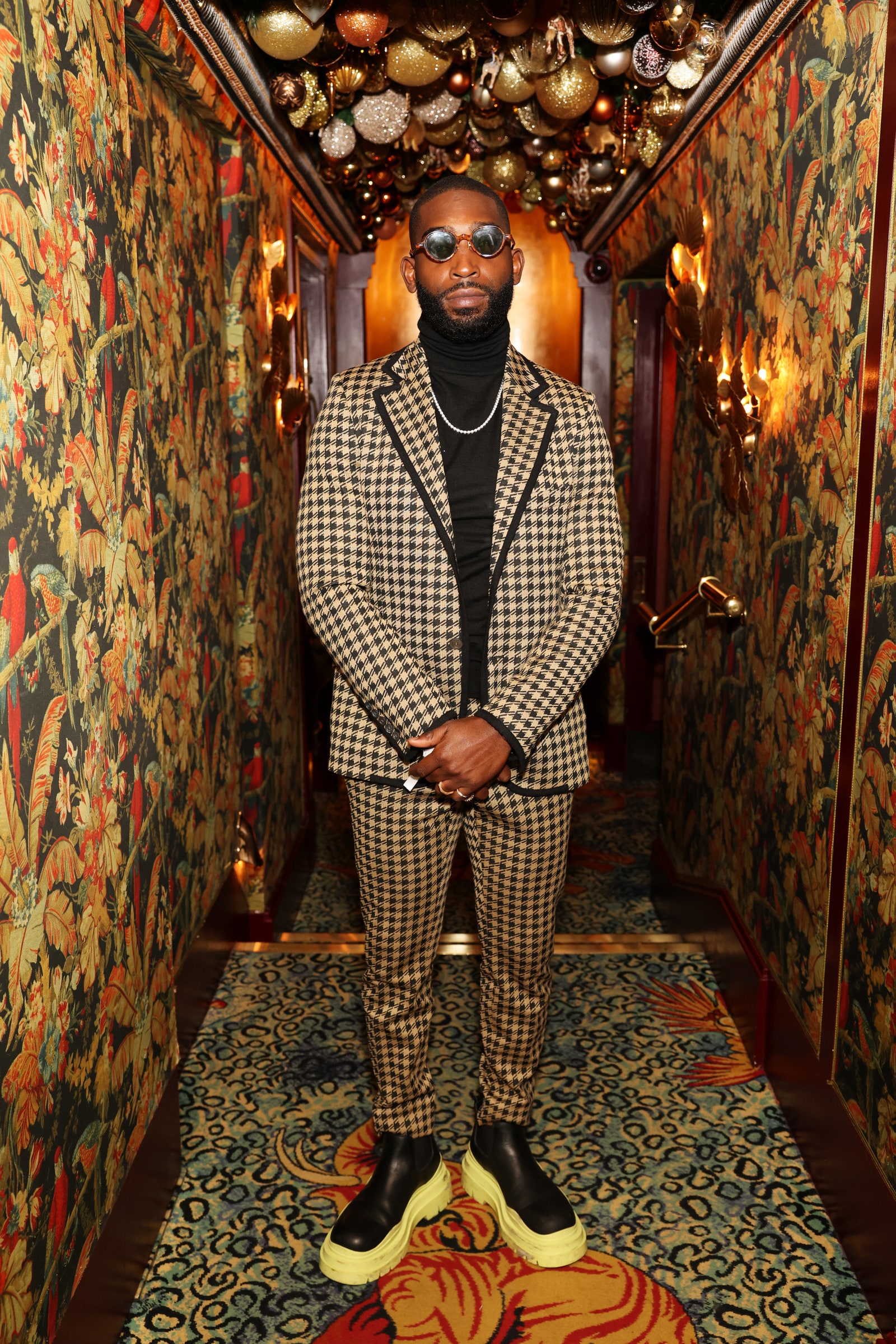 Image may contain Tinie Tempah Sunglasses Accessories Accessory Human Person Clothing Apparel Footwear and Shoe