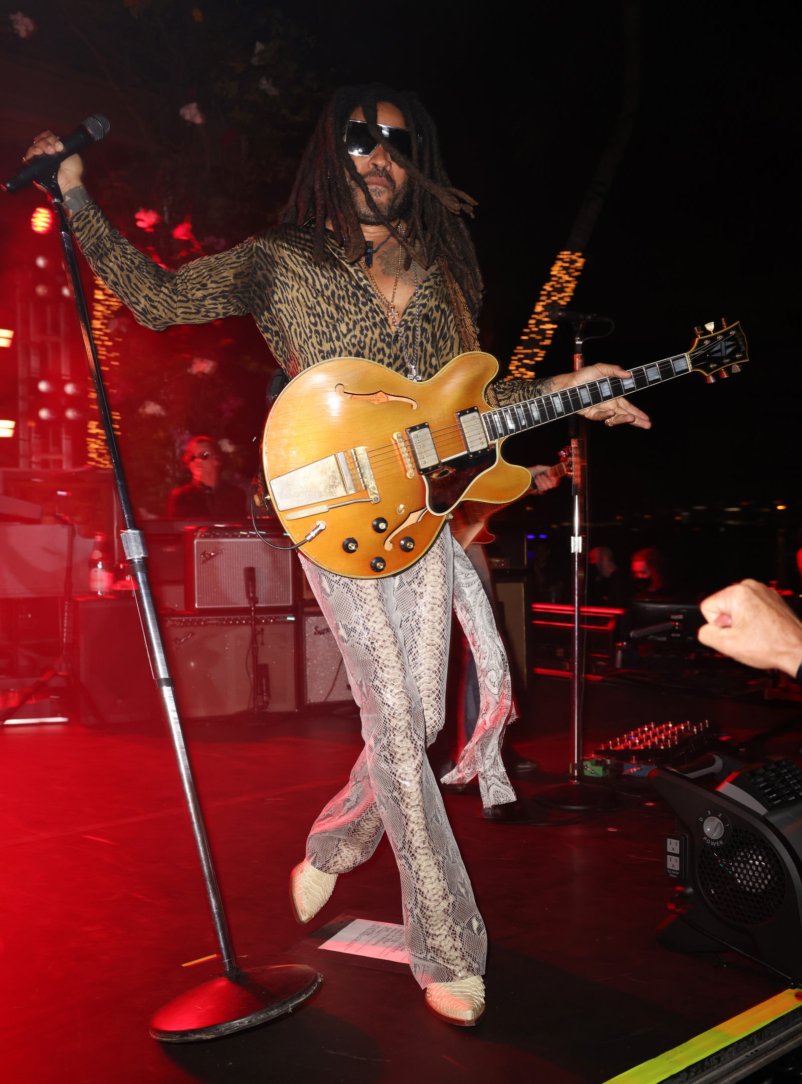 Image may contain Musical Instrument Guitar Leisure Activities Musician Human Person Sunglasses and Accessories