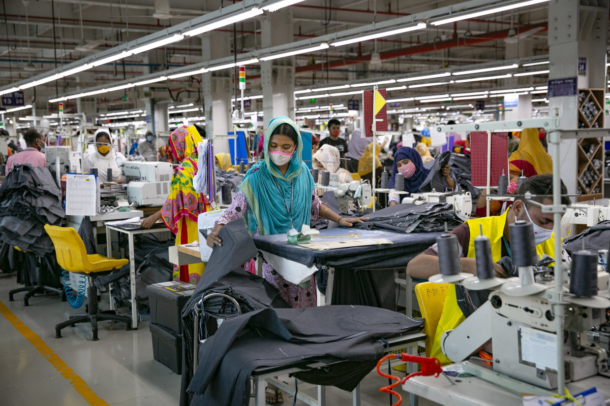 Garment workers work at a factory during a countrywide lockdown to try to contain the spread of Covid-19 on July 5, 2021 in Dhaka, Bangladesh