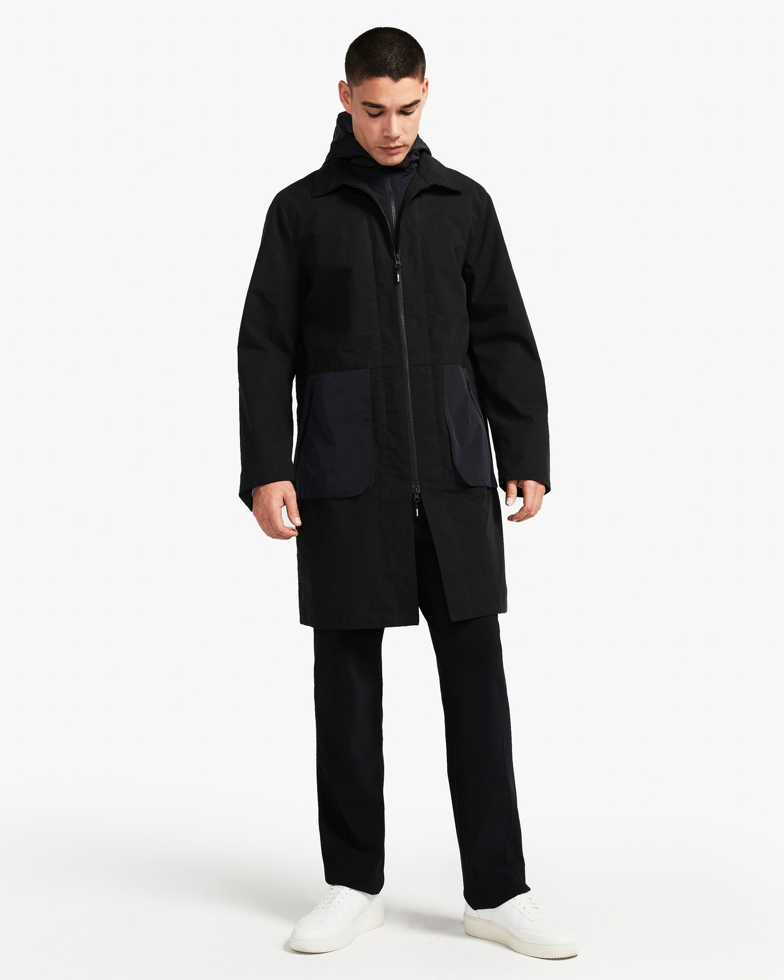 Image may contain Clothing Apparel Coat Human Person and Overcoat