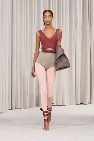 a model walks the Ferragamo spring/summer 2025 runway in the legging layering trend