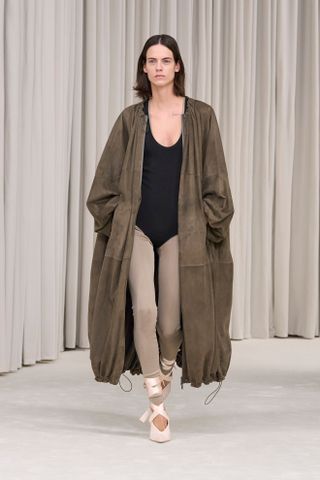 a model walks the Ferragamo spring/summer 2025 runway in the legging layering trend