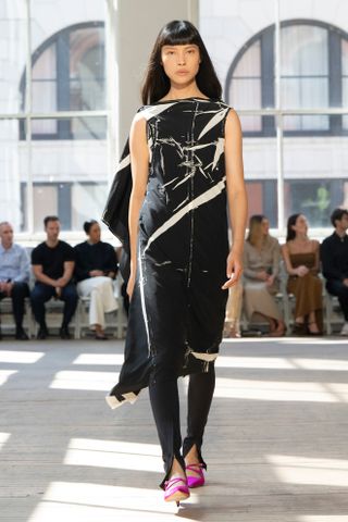 a model walks the spring 2025 Proenza Schouler runway wearing the legging layering trend